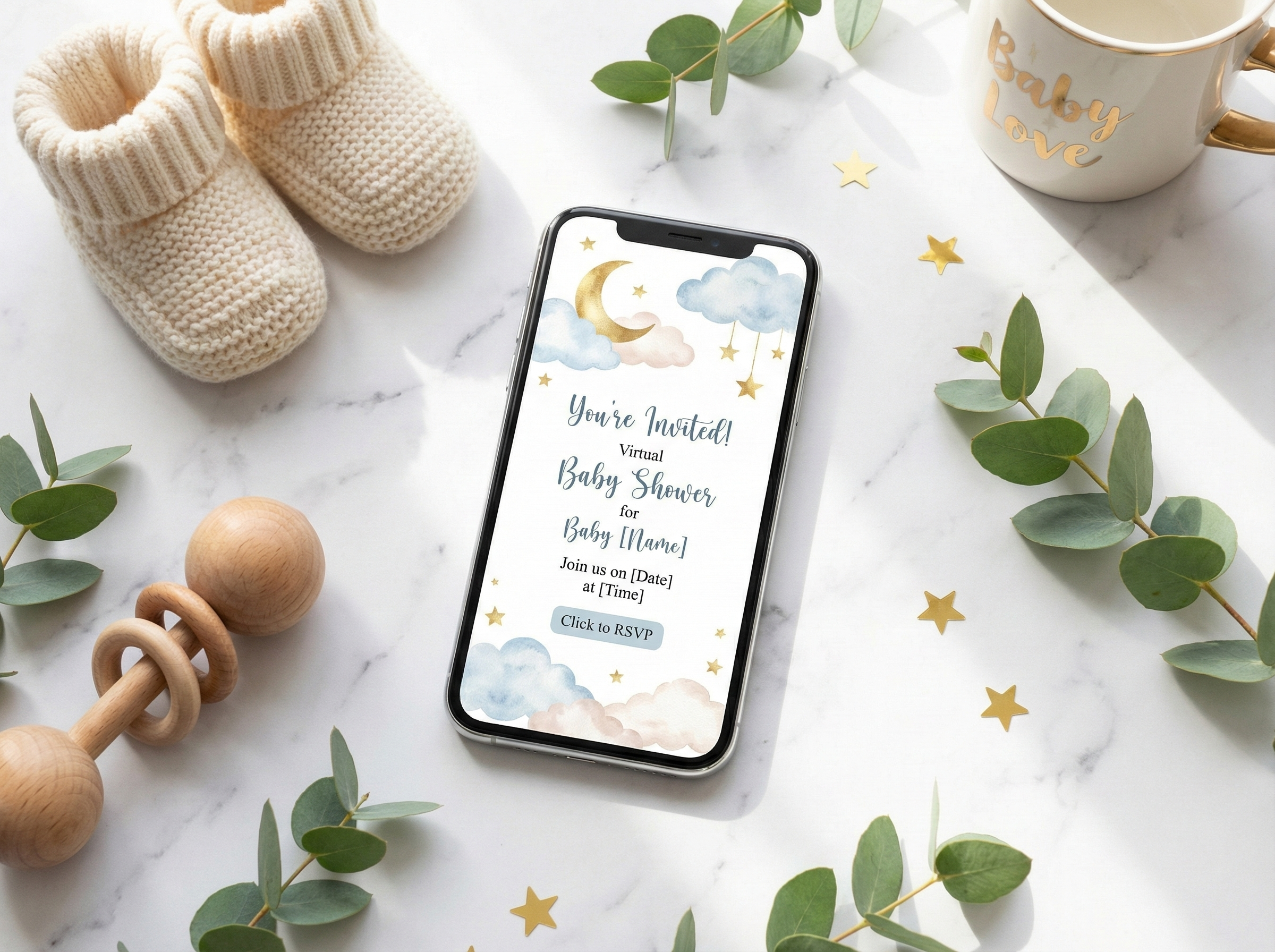 Smartphone displaying a whimsical virtual baby shower invitation design with watercolor elements and baby props